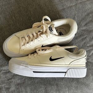 Nike Beige Sneakers with Black Logo
